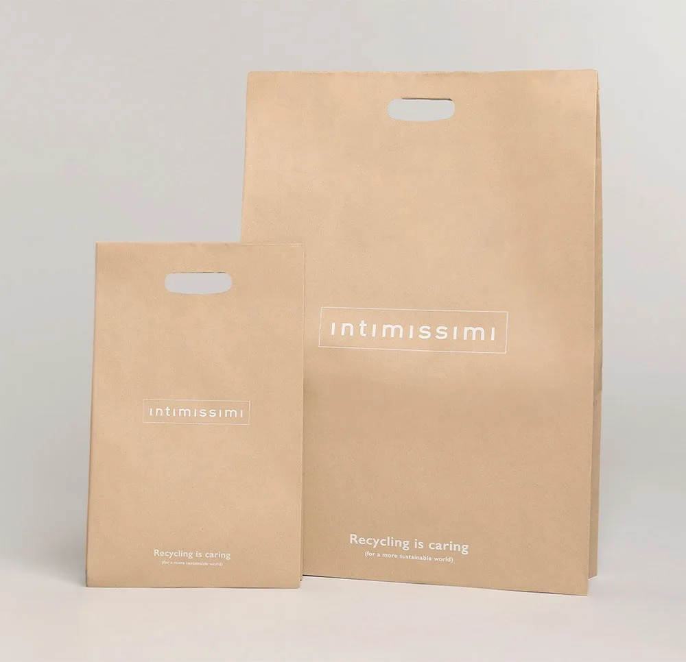 Due buste color cartone con logo Intimissimi e scritta "Recycling is caring"